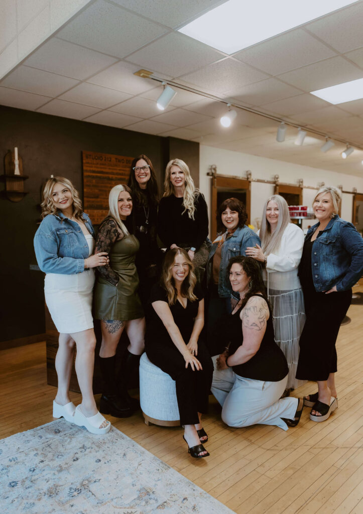 - Ibi David Salon in Westlake, OH A group of nine women pose and smile together inside a salon or studio with wooden floors and modern decor. - Ibi David Salon in Westlake, OH